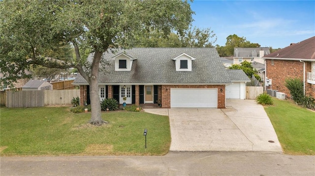 cape cod-style house with a front yard and a garage