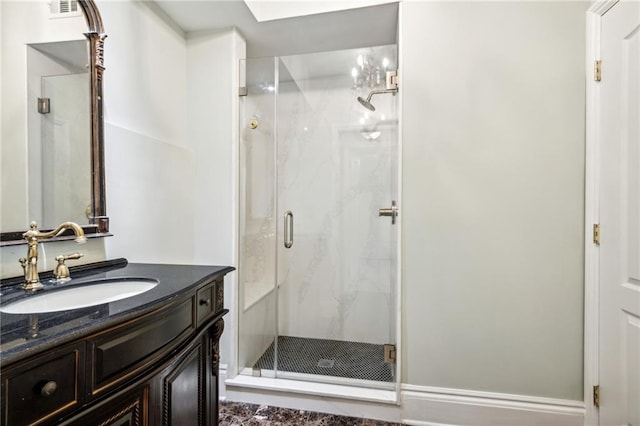1216 Burgundy St, New Orleans, LA 70116 - full bath with a marble finish shower and vanity