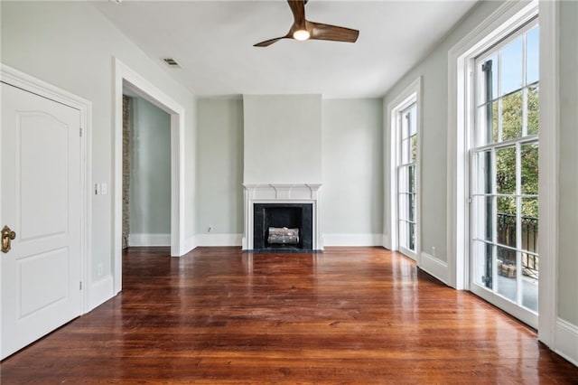 unfurnished living room with ceiling fan and wood-type flooring