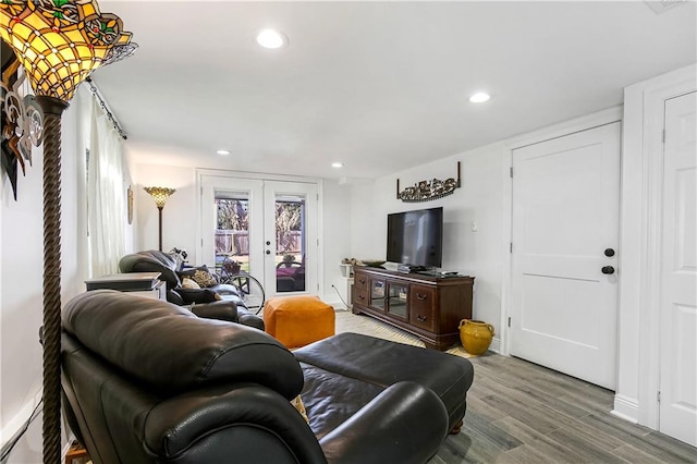 living room with french doors and hardwood / wood-style flooring