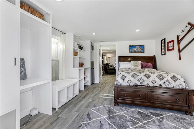 bedroom with hardwood / wood-style flooring