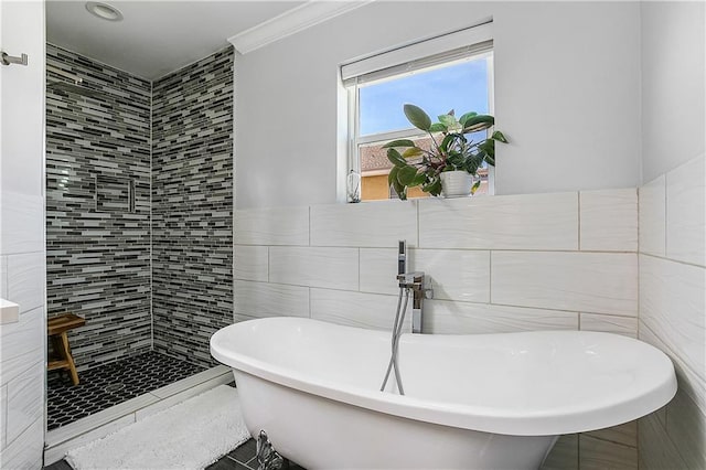 bathroom featuring tile walls and plus walk in shower