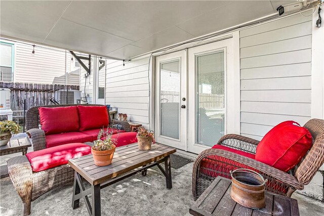 view of patio / terrace with an outdoor living space and french doors