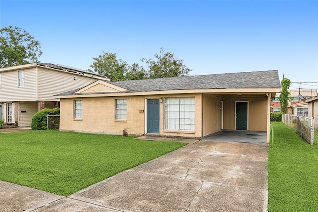 ranch-style home with a front lawn and a carport