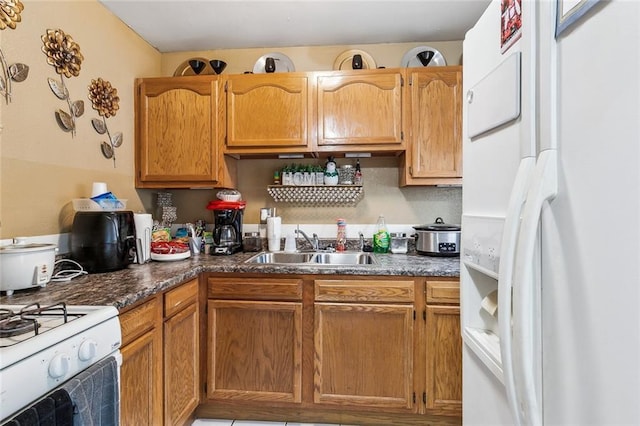 kitchen with sink and white appliances