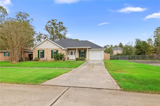 ranch-style house featuring a garage and a front lawn