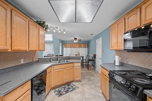 kitchen featuring black appliances, sink, ceiling fan, and backsplash