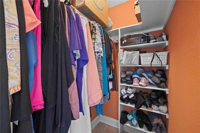 spacious closet with tile patterned flooring