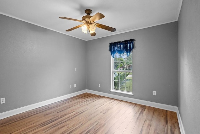 unfurnished room with light wood-type flooring, ceiling fan, and crown molding