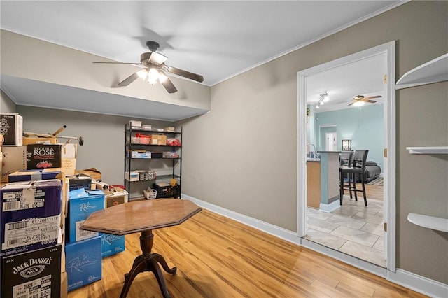 home office featuring hardwood / wood-style flooring and crown molding