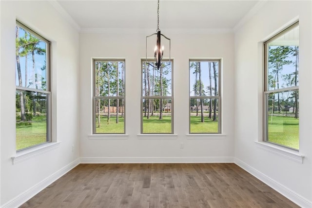 unfurnished sunroom featuring a wealth of natural light and a notable chandelier