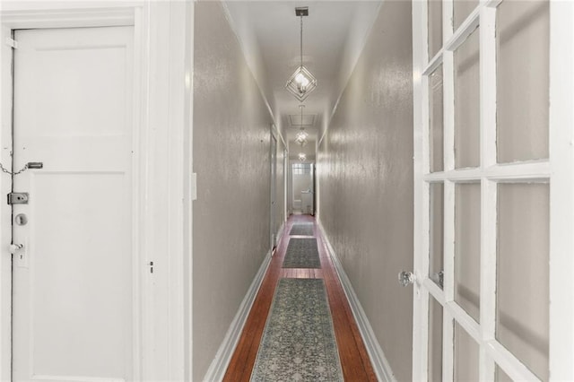 corridor featuring dark hardwood / wood-style floors