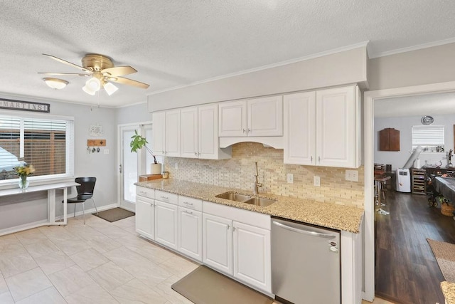 kitchen featuring dishwasher, white cabinets, light wood-type flooring, and sink