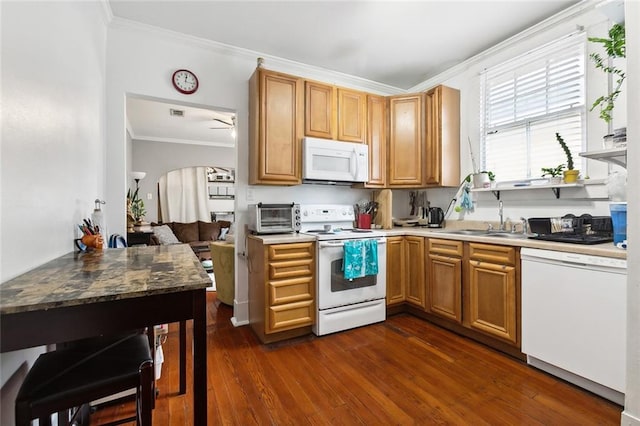 kitchen featuring ornamental molding, dark hardwood / wood-style flooring, sink, and white appliances