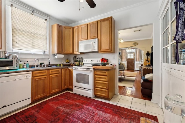 kitchen featuring light hardwood / wood-style floors, sink, ornamental molding, ceiling fan, and white appliances