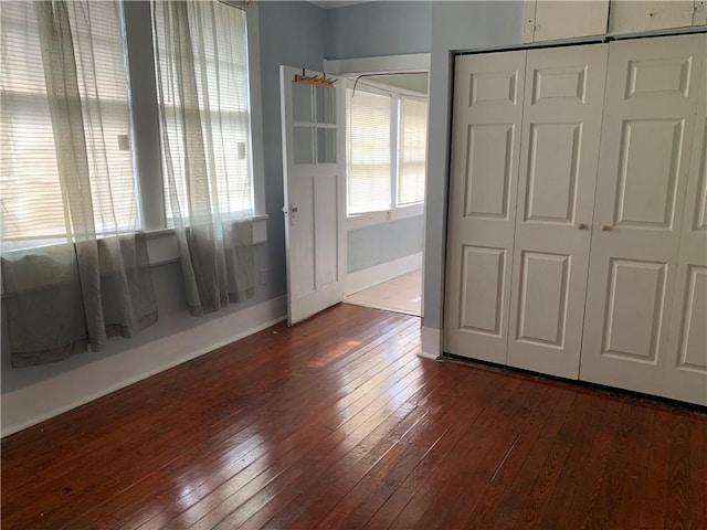 interior space featuring a closet and dark hardwood / wood-style floors