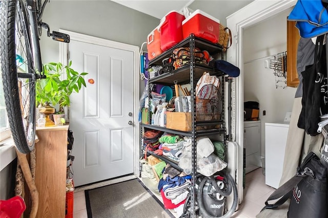 storage area featuring washer and clothes dryer