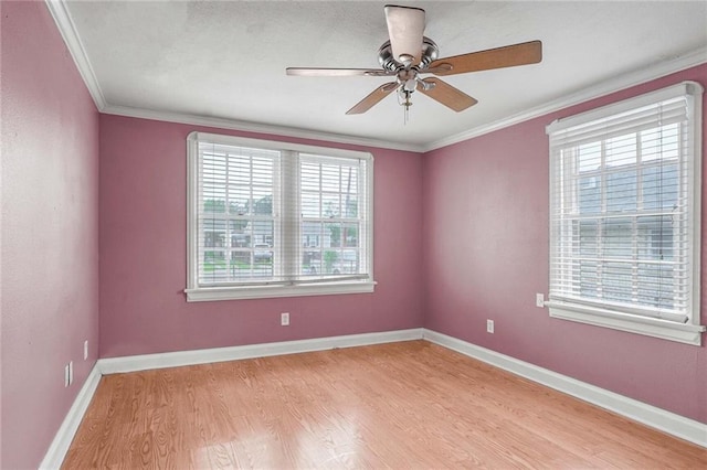 unfurnished room with crown molding, ceiling fan, and light hardwood / wood-style floors