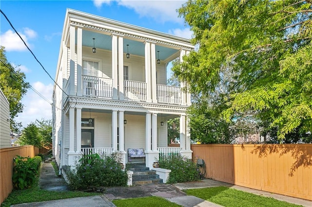 view of front facade featuring a balcony and a porch