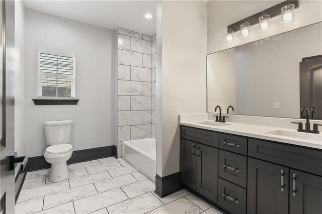3227 Toledano St, New Orleans, LA 70125 - full bathroom with marble look tiles, baseboards, toilet, recessed lighting, and double vanity