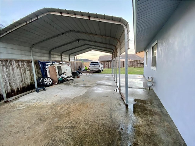 view of vehicle parking with a carport