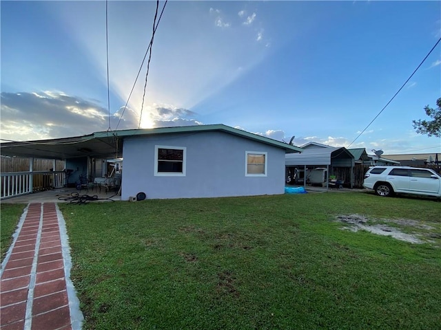 view of side of property featuring a yard