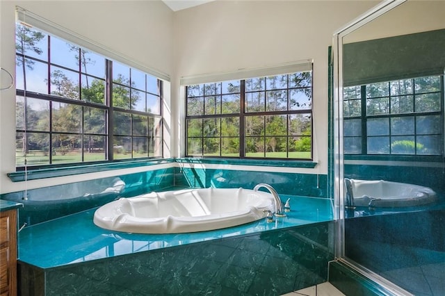 bathroom featuring tiled bath