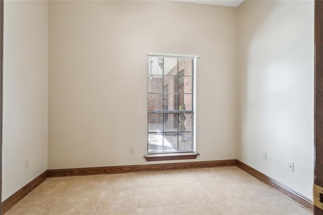 spare room with light tile patterned floors