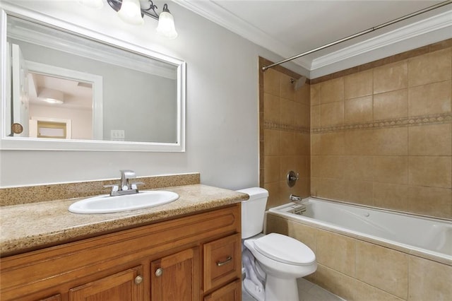 full bathroom featuring vanity, tiled shower / bath, toilet, and ornamental molding