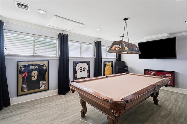 rec room with billiards, ornamental molding, and light hardwood / wood-style flooring