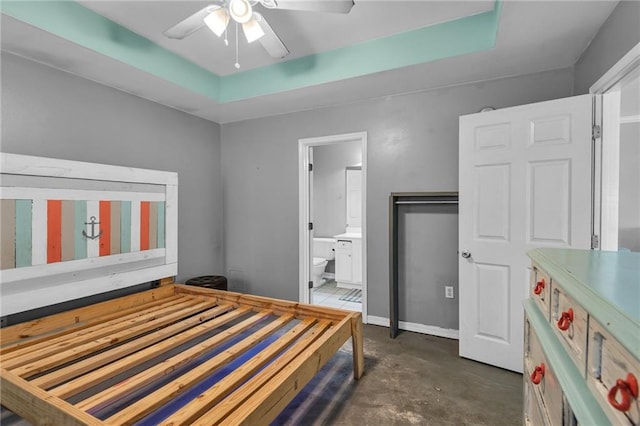 bedroom featuring ensuite bath and ceiling fan