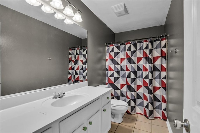 bathroom with vanity, tile patterned flooring, toilet, and a shower with curtain