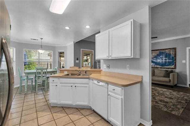 kitchen with dishwasher, stainless steel refrigerator, and white cabinets