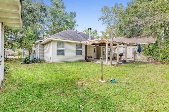 rear view of property featuring cooling unit, a yard, a patio, and a pergola