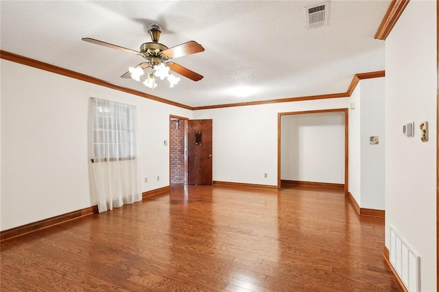 spare room featuring hardwood / wood-style flooring, crown molding, and ceiling fan