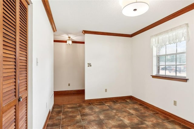 unfurnished room featuring ornamental molding