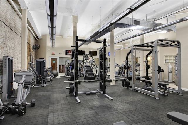 gym with a towering ceiling