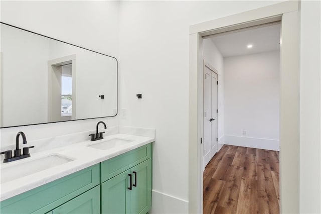 bathroom featuring hardwood / wood-style floors and vanity