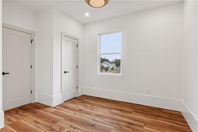 spare room featuring light hardwood / wood-style flooring