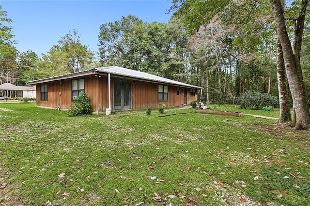 view of home's exterior featuring a lawn