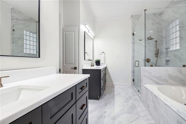 bathroom featuring vanity, separate shower and tub, and ornamental molding