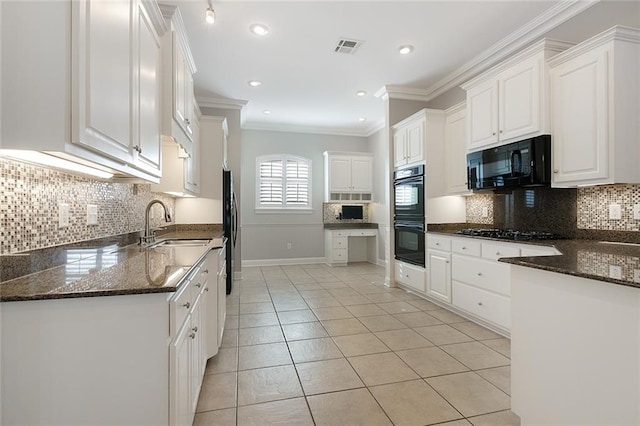 kitchen featuring black appliances, decorative backsplash, white cabinetry, and ornamental molding