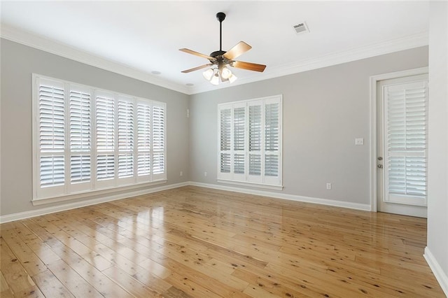 empty room featuring ceiling fan, ornamental molding, and light hardwood / wood-style flooring