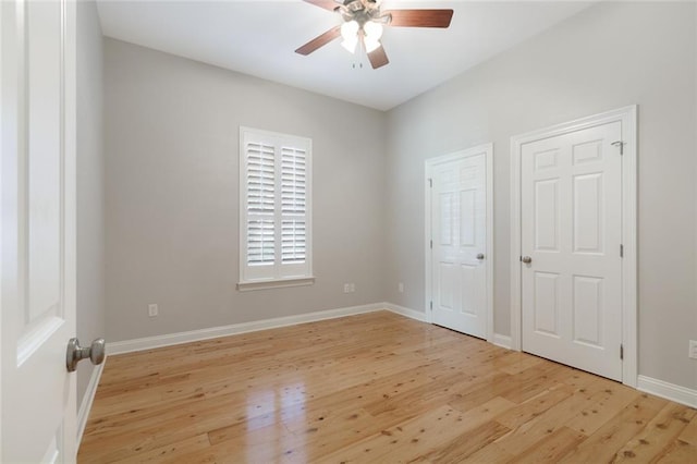 unfurnished bedroom with ceiling fan and light wood-type flooring