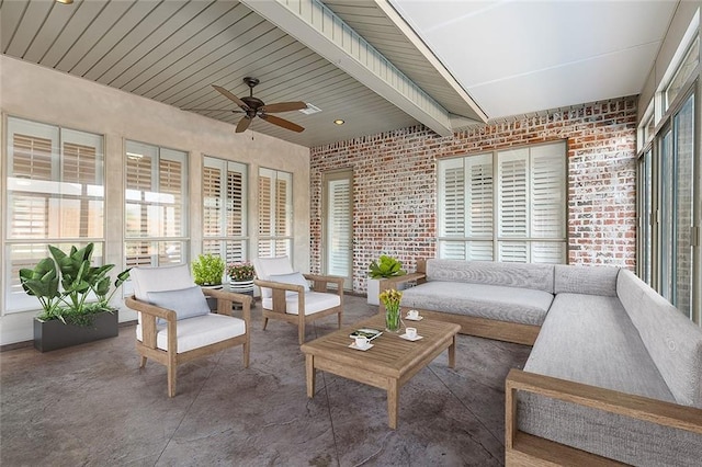 sunroom with wood ceiling, plenty of natural light, and ceiling fan