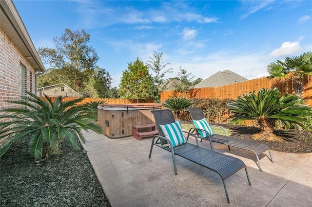 view of patio / terrace featuring a hot tub