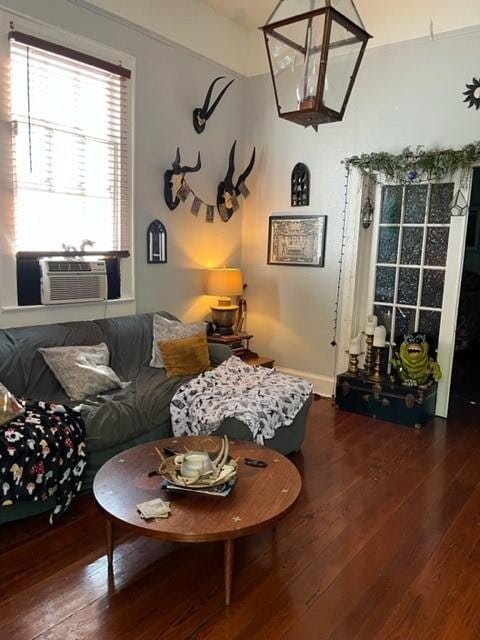 living room featuring a chandelier, cooling unit, and dark hardwood / wood-style flooring