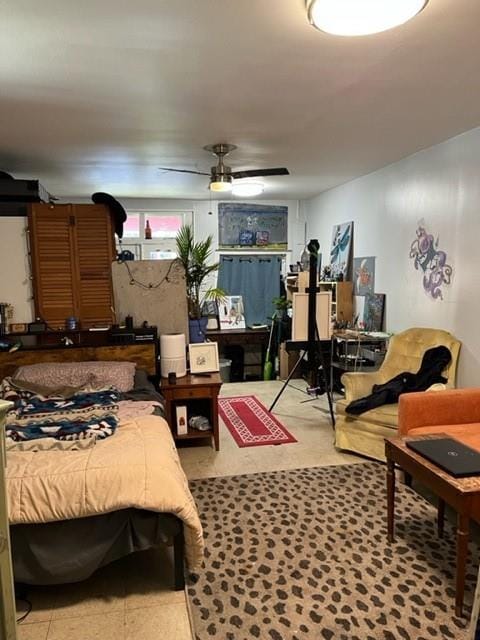 tiled bedroom with ceiling fan