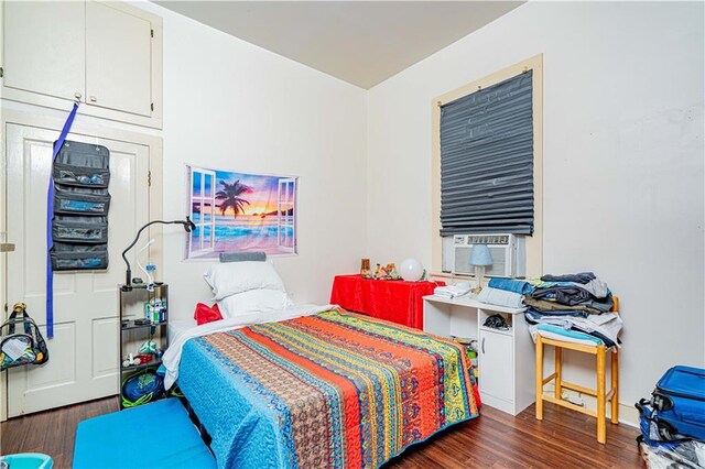 bedroom featuring dark wood-type flooring