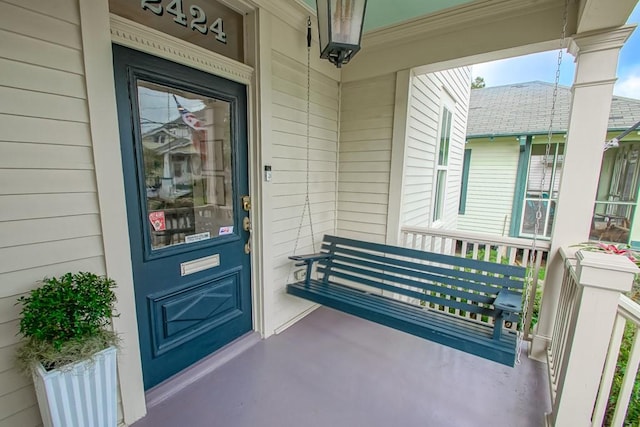 property entrance featuring a porch